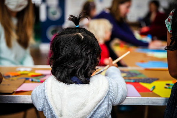 
      Children painting at an art class