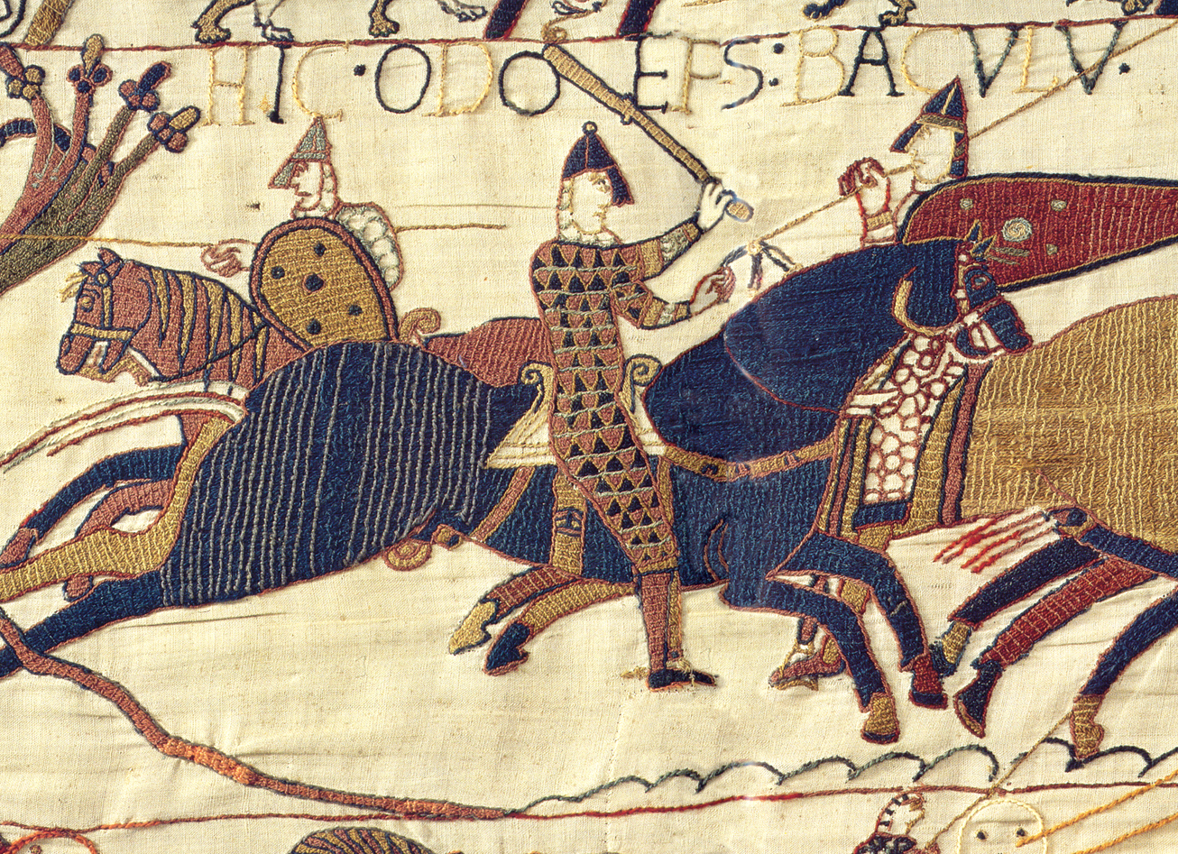 Section of the Bayeux Tapestry depicting a battle scene with soldiers on horseback.